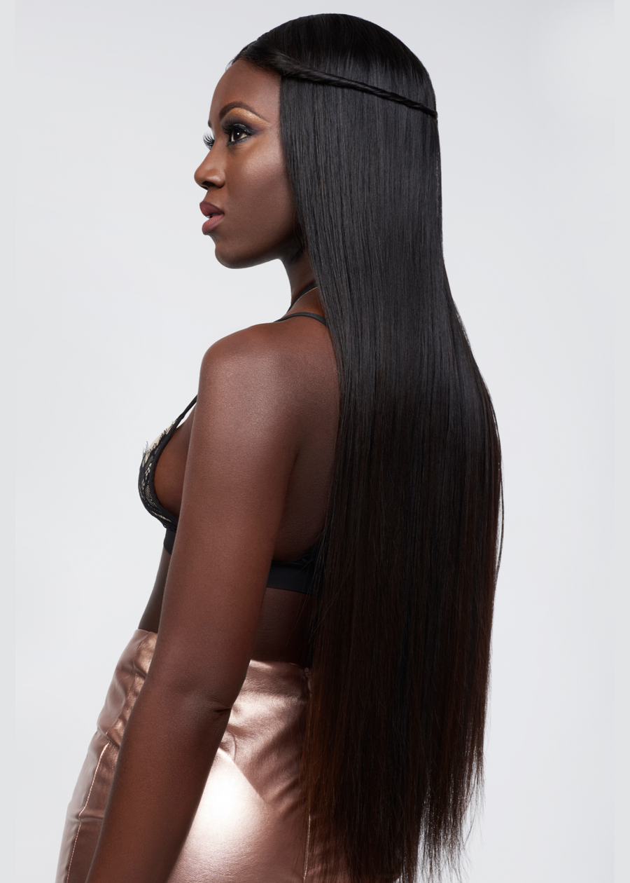 Black woman wearing malaysian hair extensions