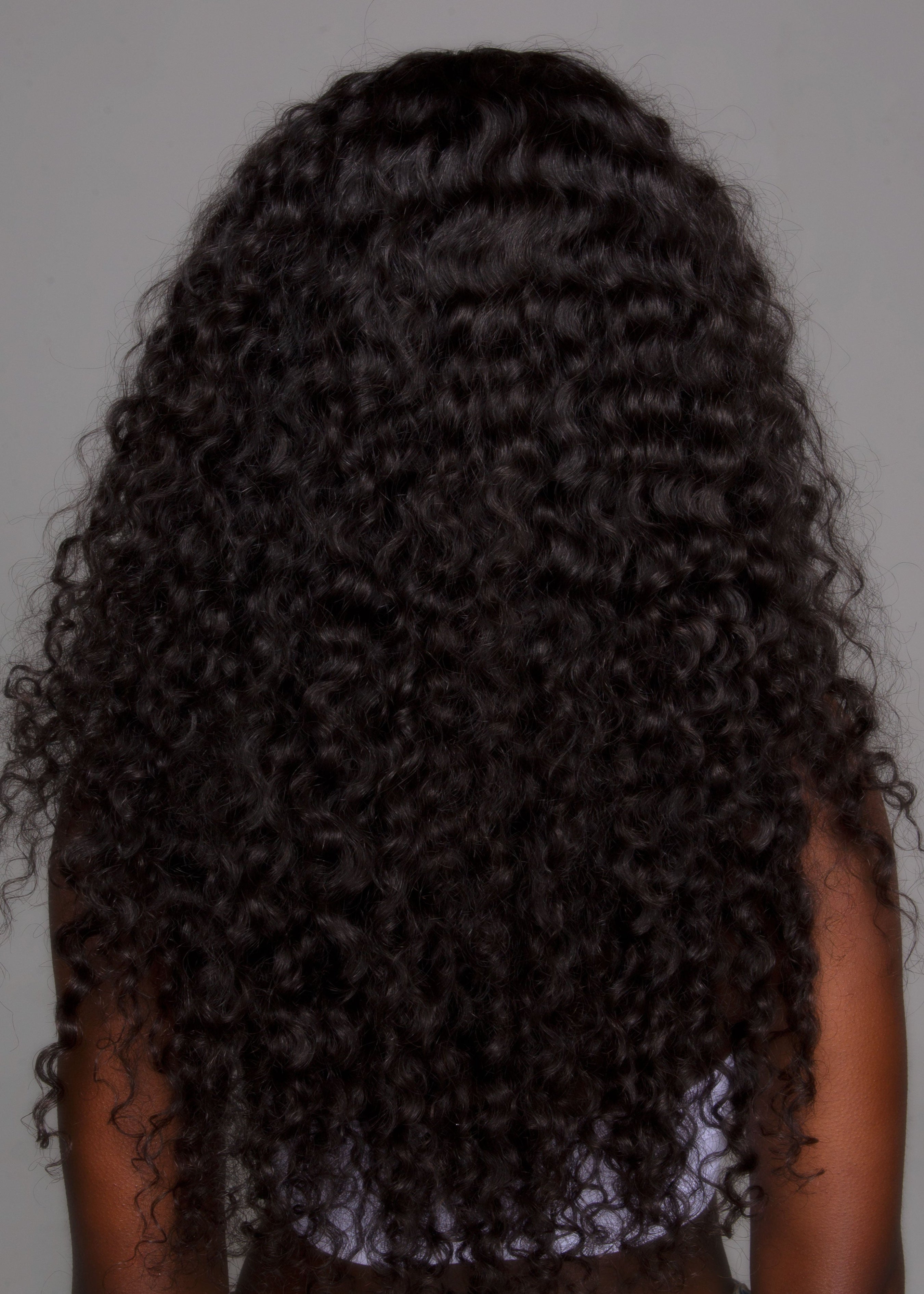 Model wearing Curly Peruvian Hair Extensions