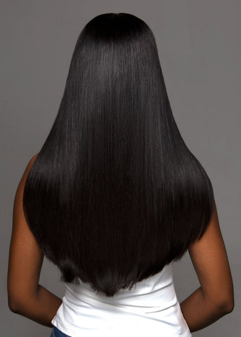 Model with short Peruvian Hair Extensions with her back towards the screen